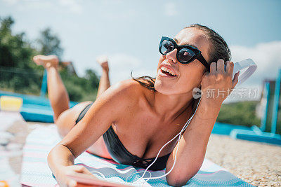 Woman by the pool can get tanned